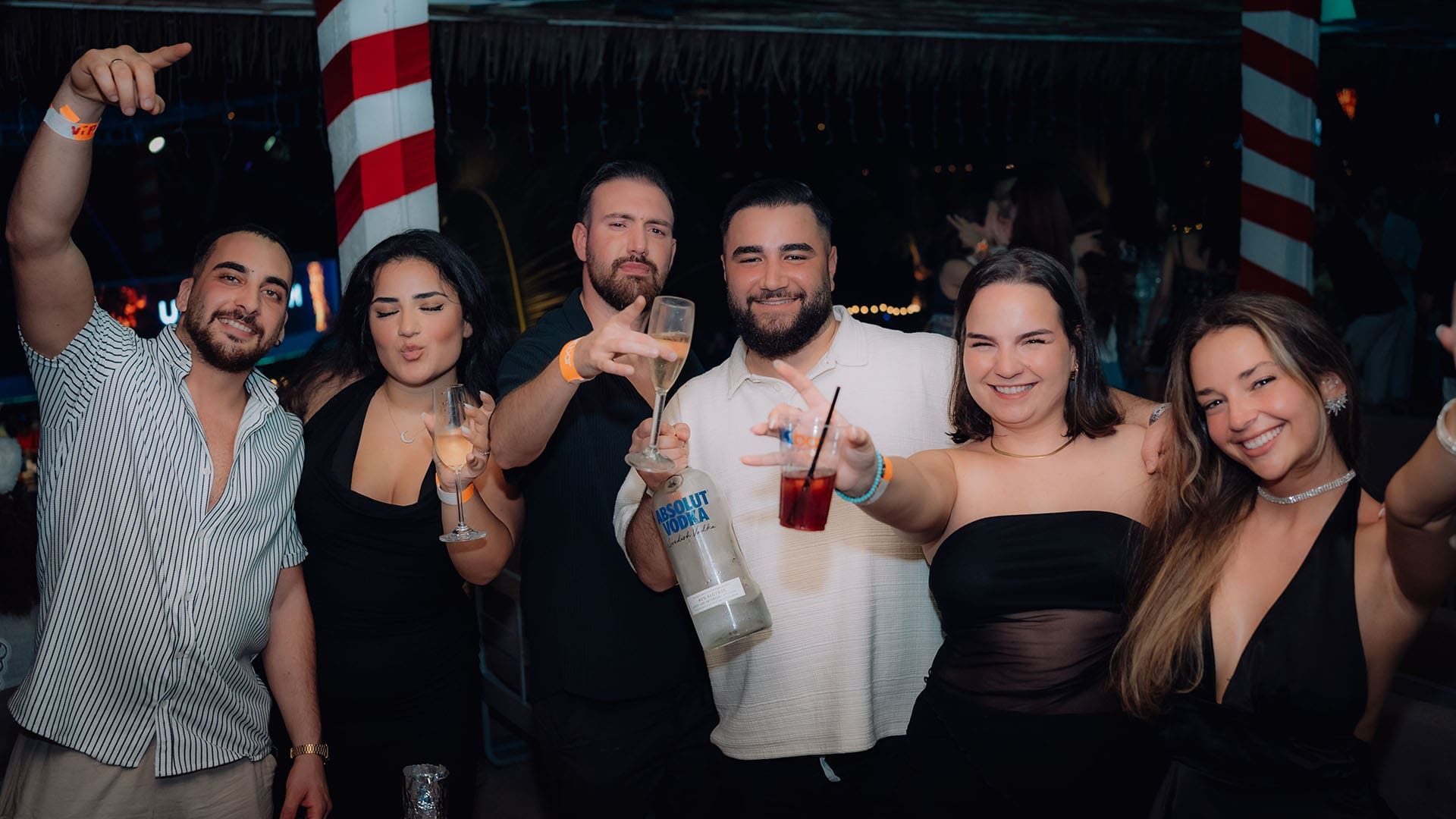 Group of friends enjoying bottle service and nightlife at ARKbar Beach Club in Koh Samui
