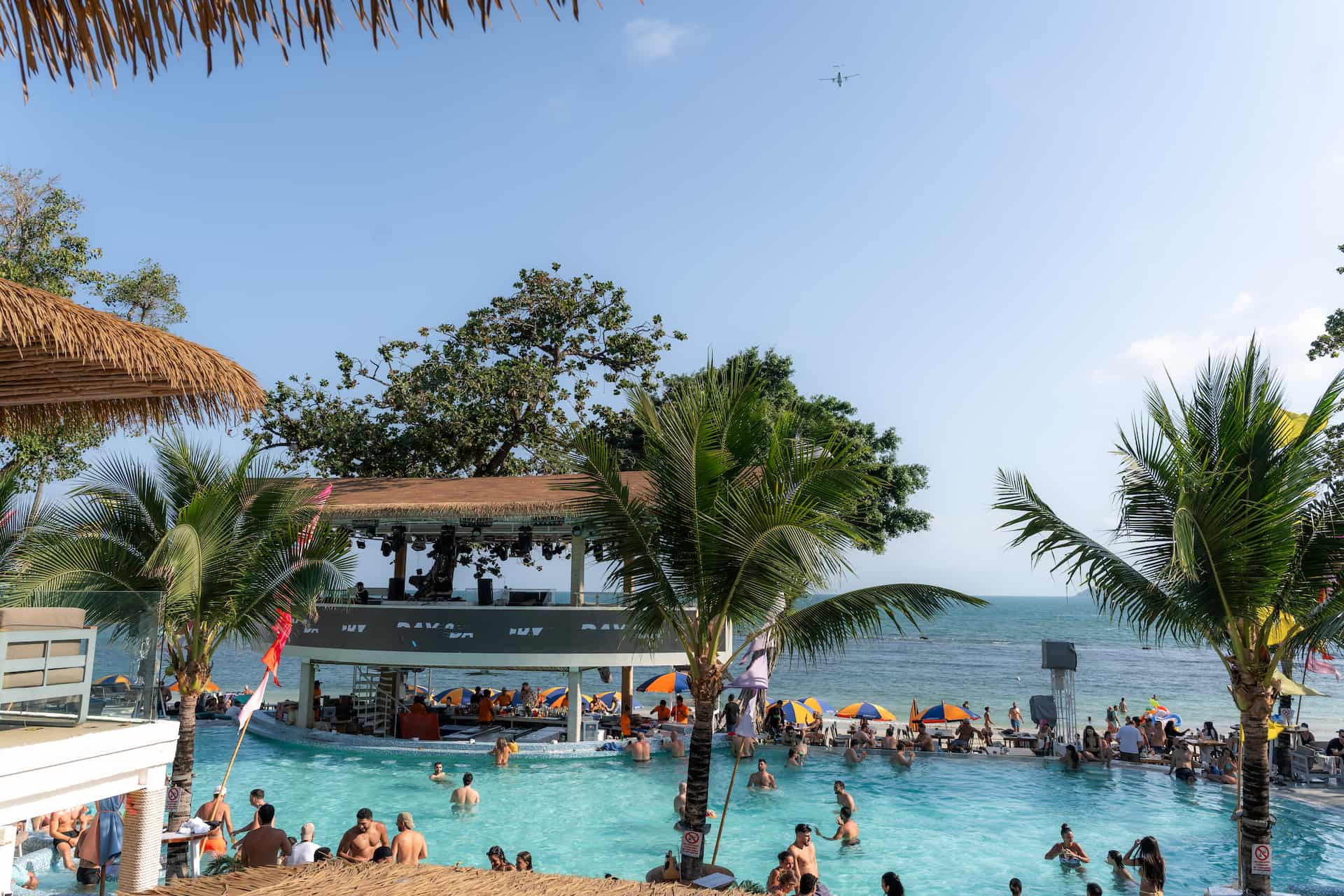 Pool party Koh Samui at ARKbar Beach Club Chaweng Beach with DJ stage and ocean view